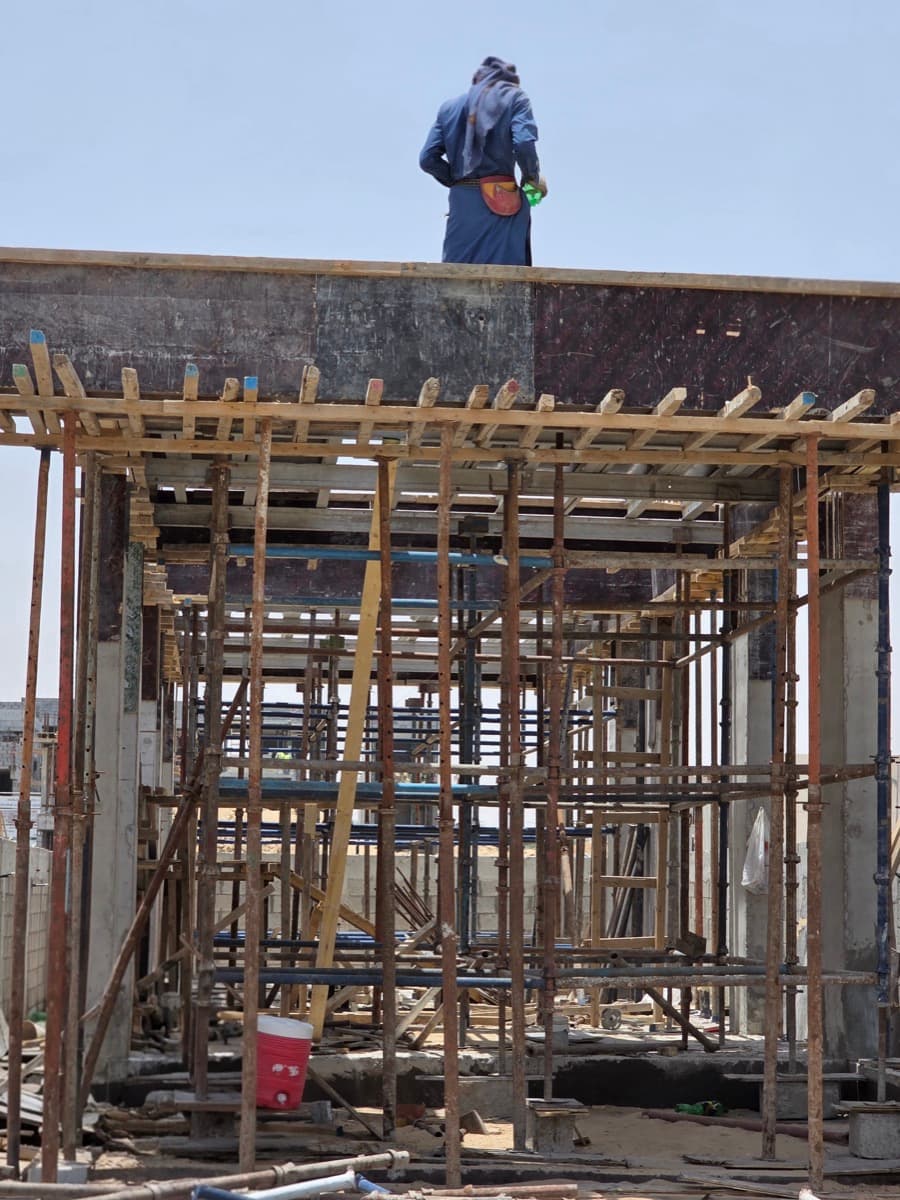 Slab formwork and timber falsework with site crew